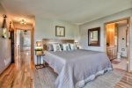 Master Bedroom with luxurious bedding, Tempurpedic King bed, smart TV and views of the aspen grove/mountain range.